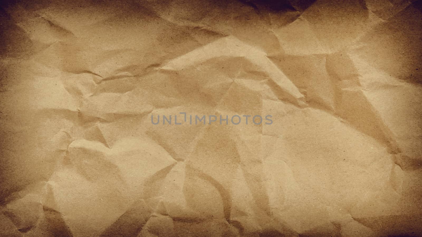 Crumpled paper background vignette space for text or image.Old paper texture