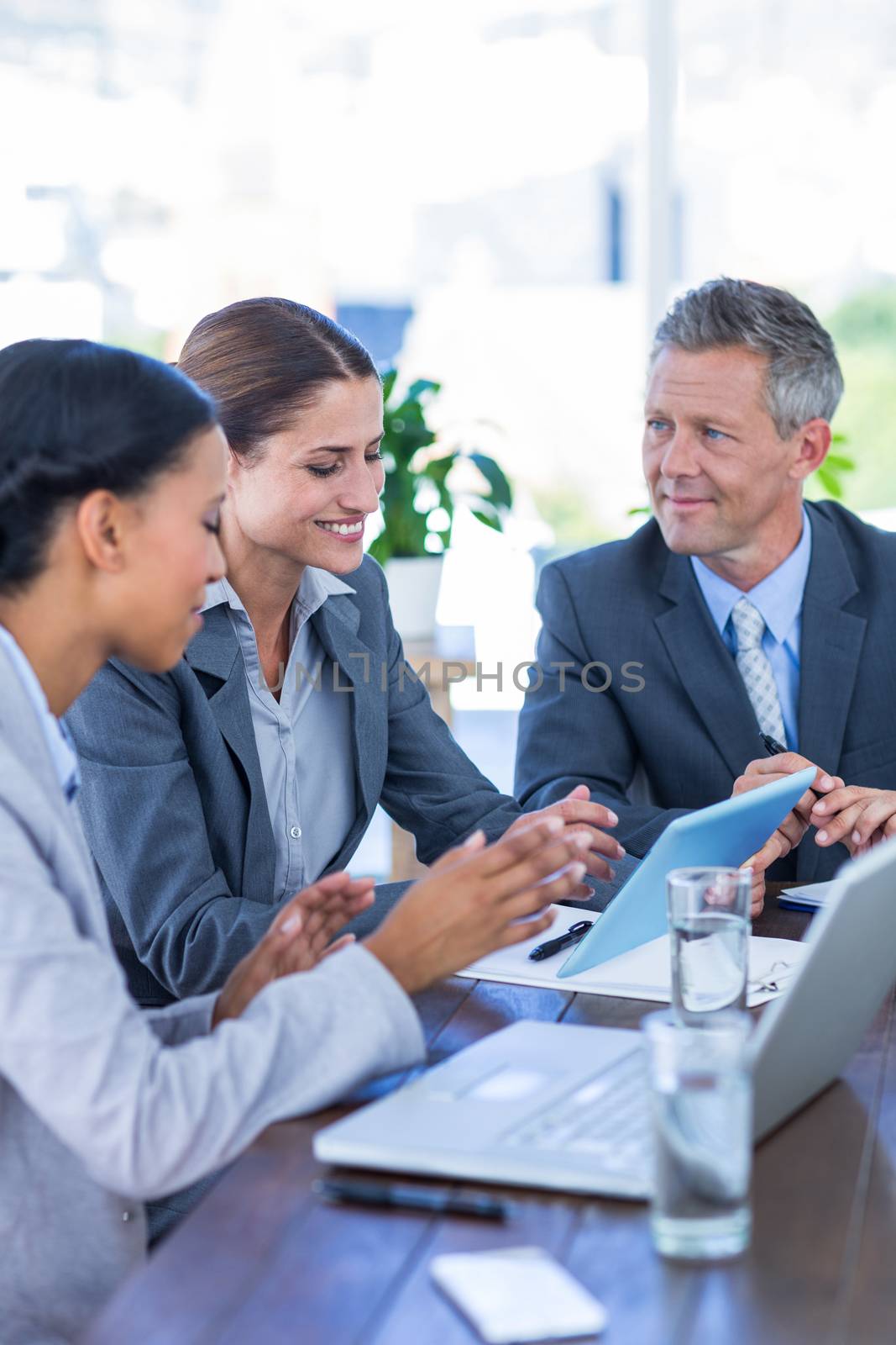 Business people working at desk  by Wavebreakmedia