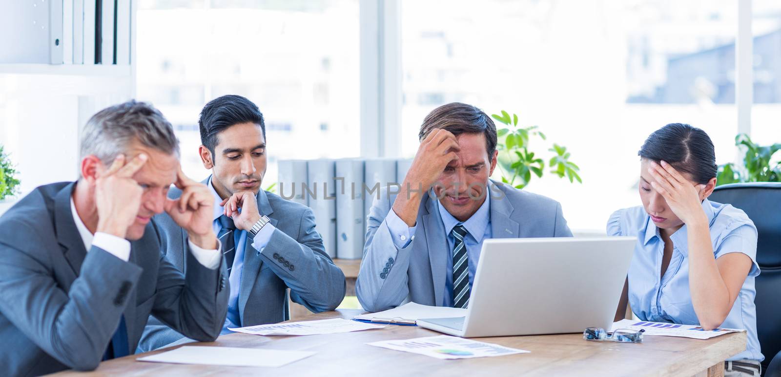 Thoughtful business people during meeting in office