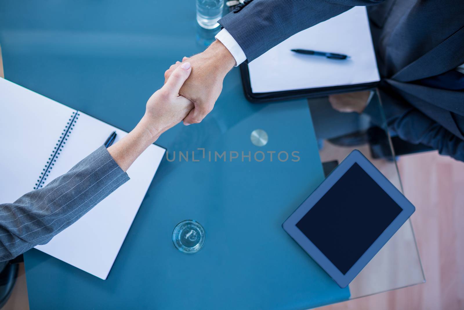 Business people shaking hands in office