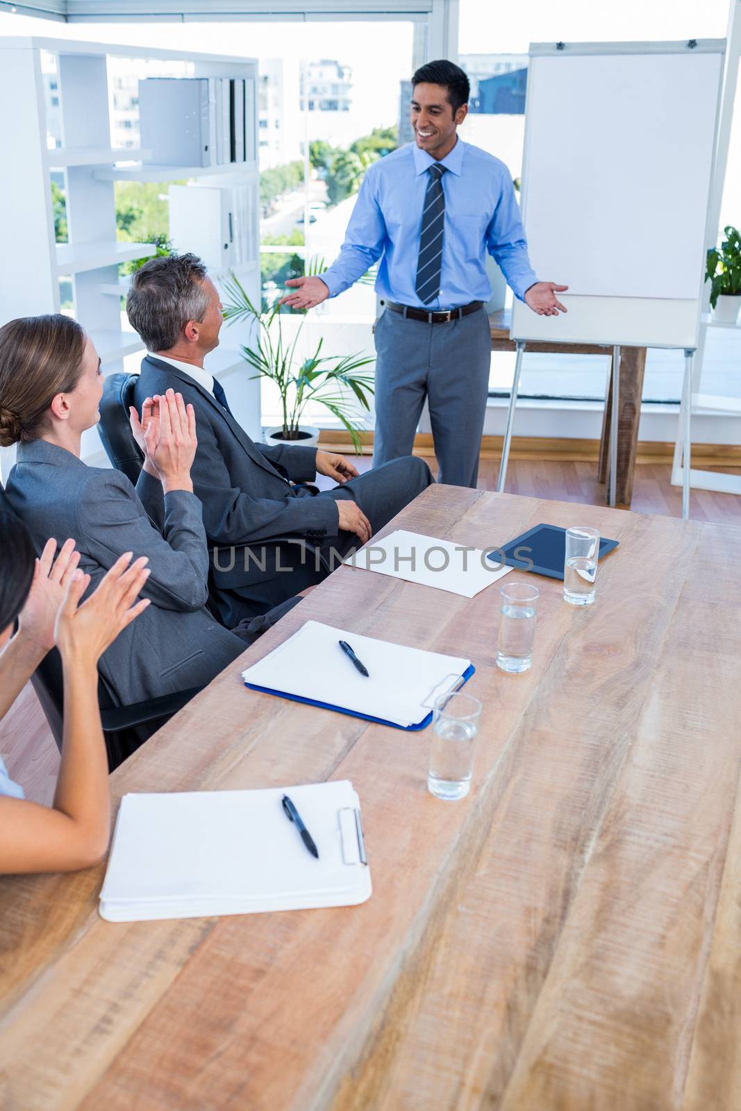 Business people applauding during a meeting by Wavebreakmedia