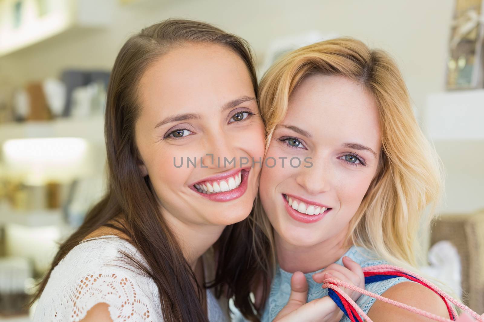 Portrait of happy women smiling at camera in a beauty salon