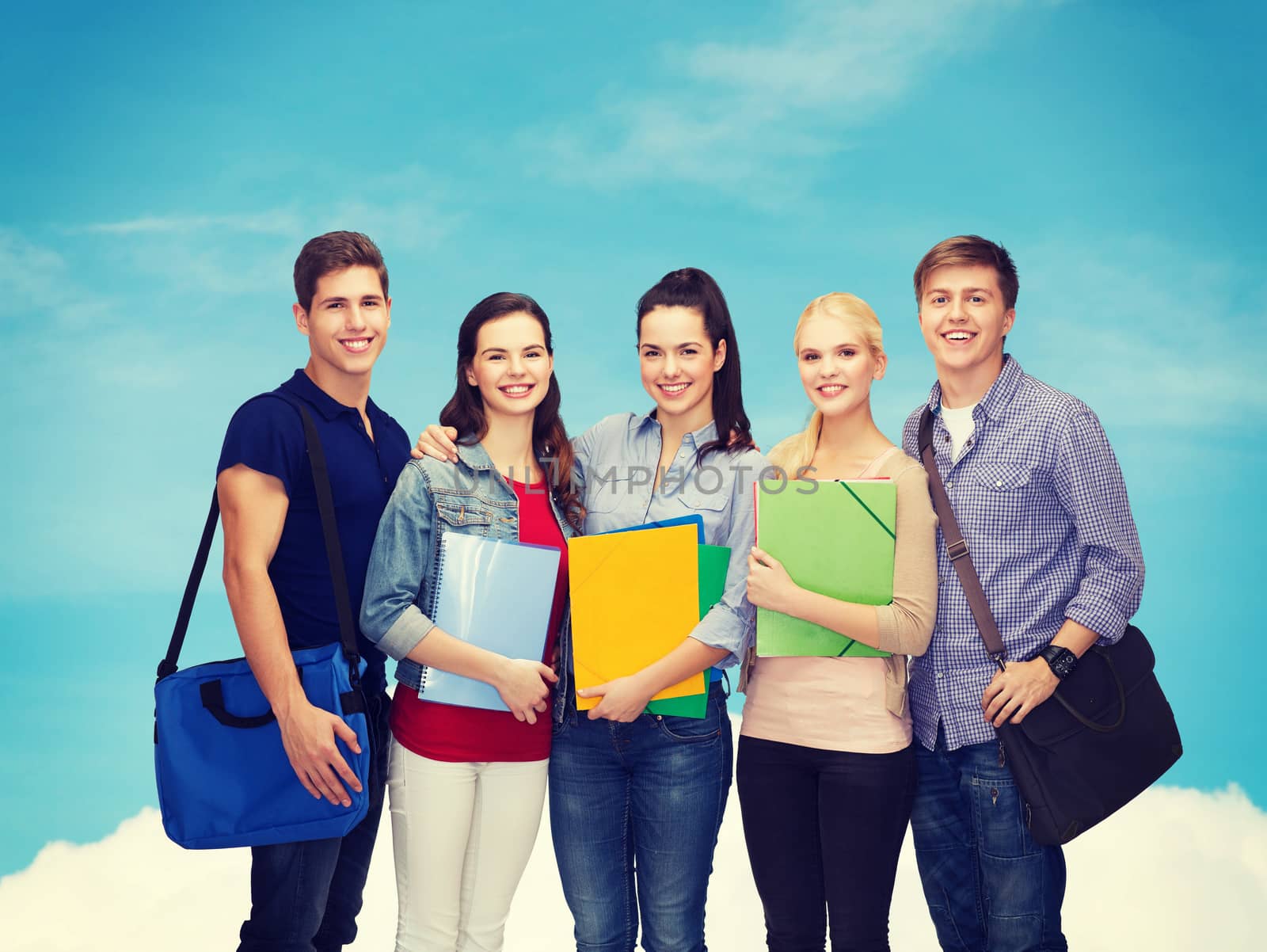 education and people concept - group of smiling students standing