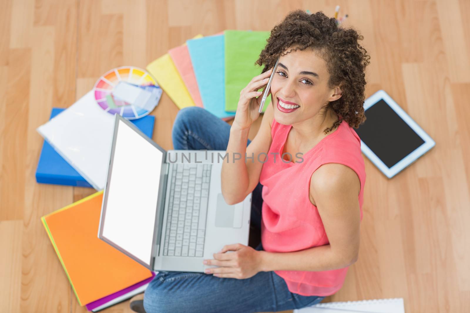 Young creative businesswoman working on laptop by Wavebreakmedia