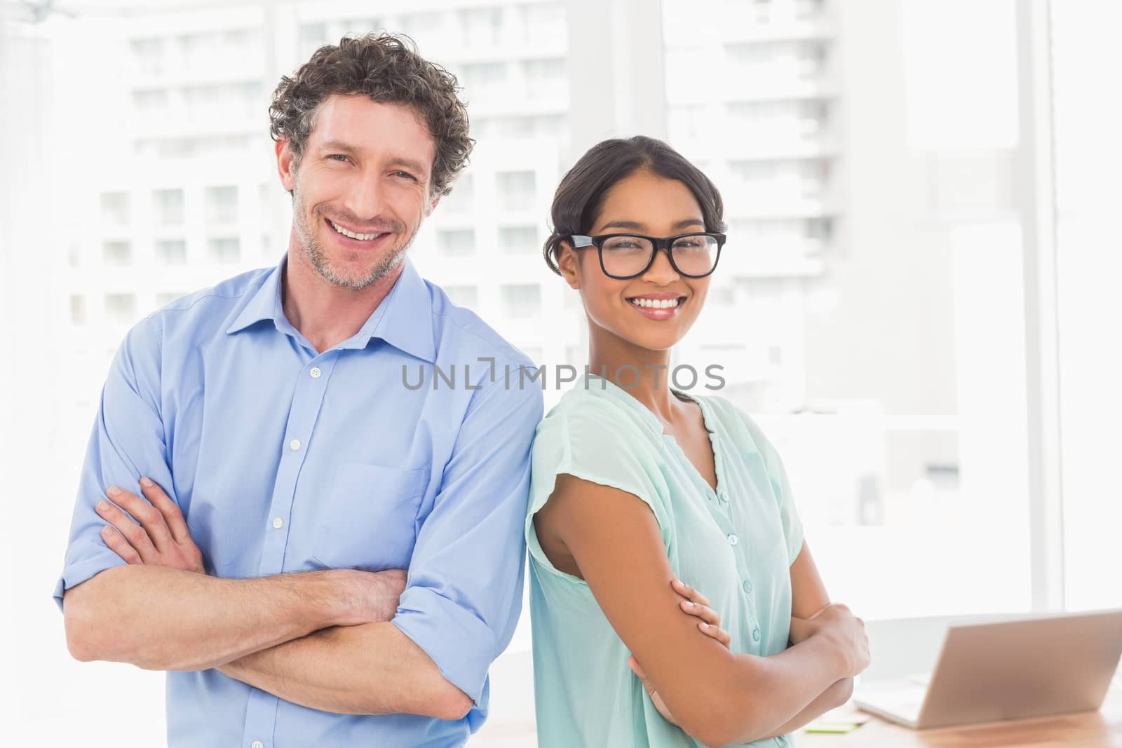 Casual business partners smiling at camera by Wavebreakmedia