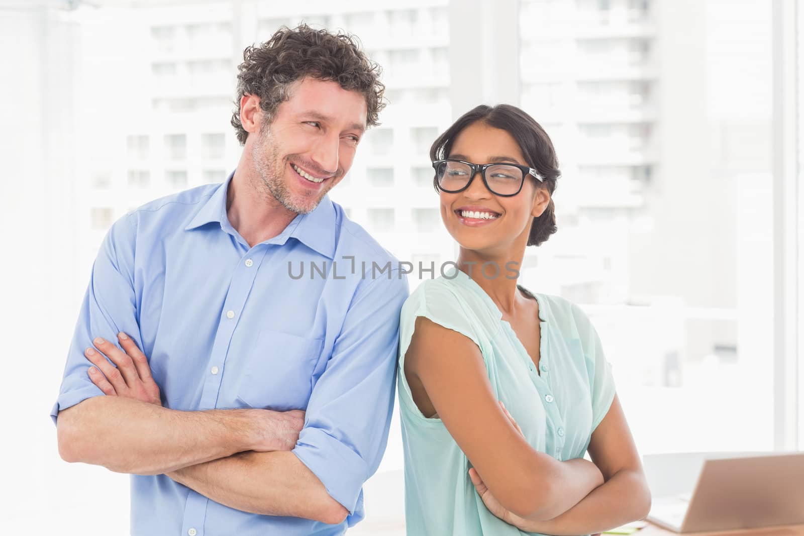 Casual business partners smiling at camera by Wavebreakmedia
