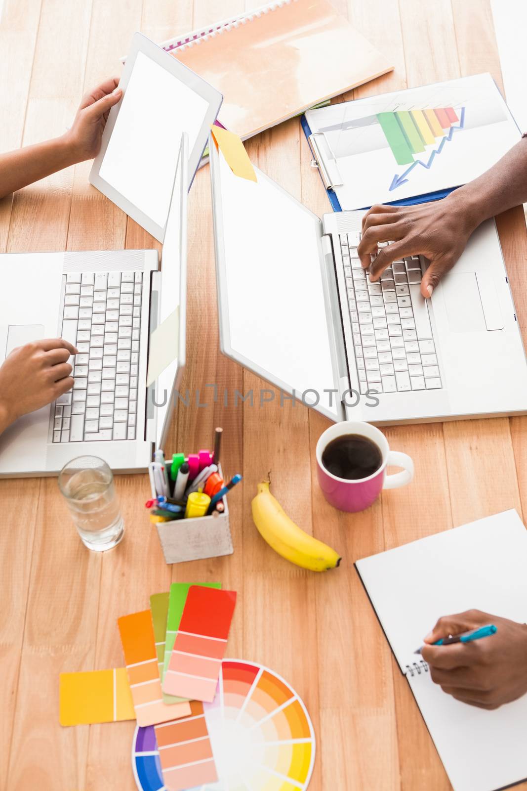 Young business people working at the laptops in the office