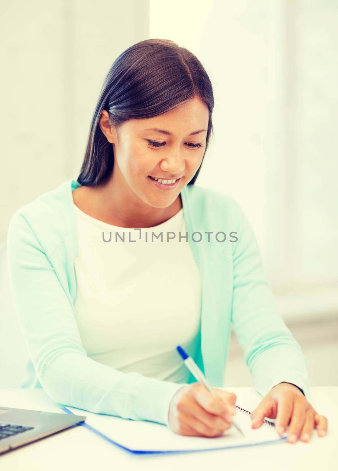 asian businesswoman with laptop and documents by dolgachov