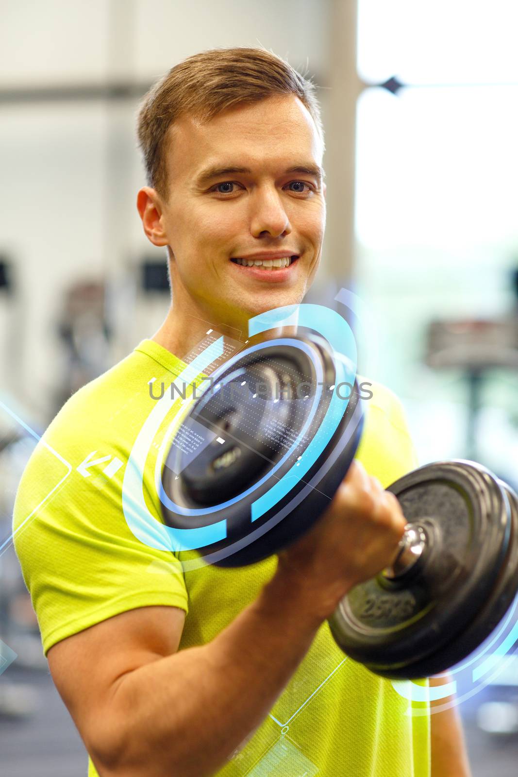 smiling man with dumbbell in gym by dolgachov