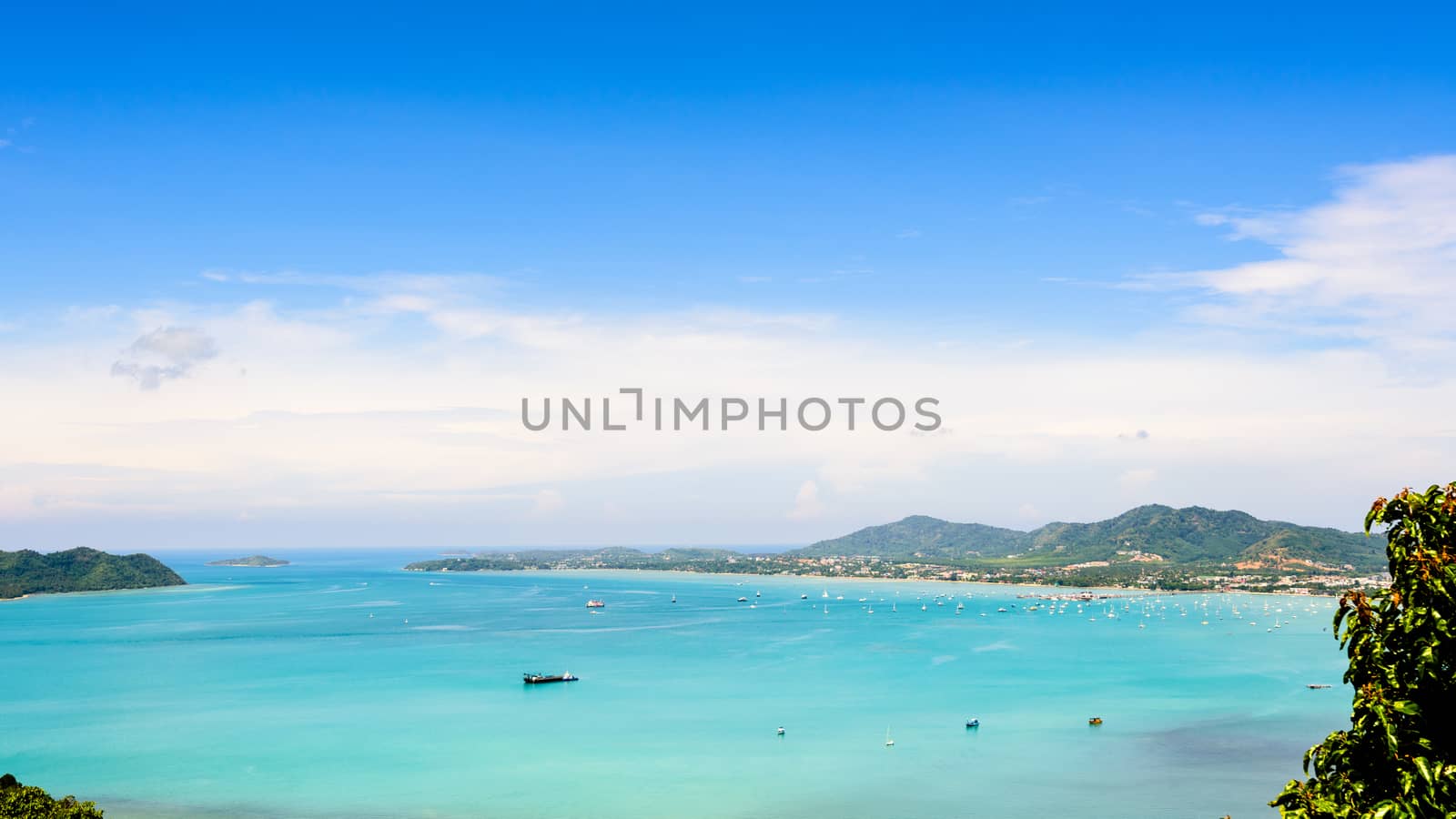 High angle view blue sky over the Andaman Sea and seaside tourist town from Khao-Khad mountain viewpoint famous attractions in Phuket island, Thailand, 16:9 Wide Screen
