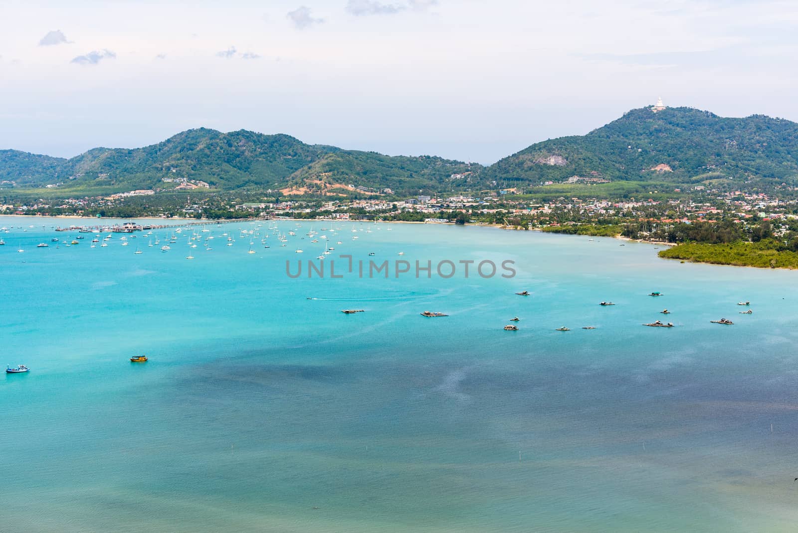 High angle view pier for travel boat at Ao Chalong bay in Phuket Island is a tourist town by the sea from Khao-Khad mountain viewpoint famous attractions of Thailand