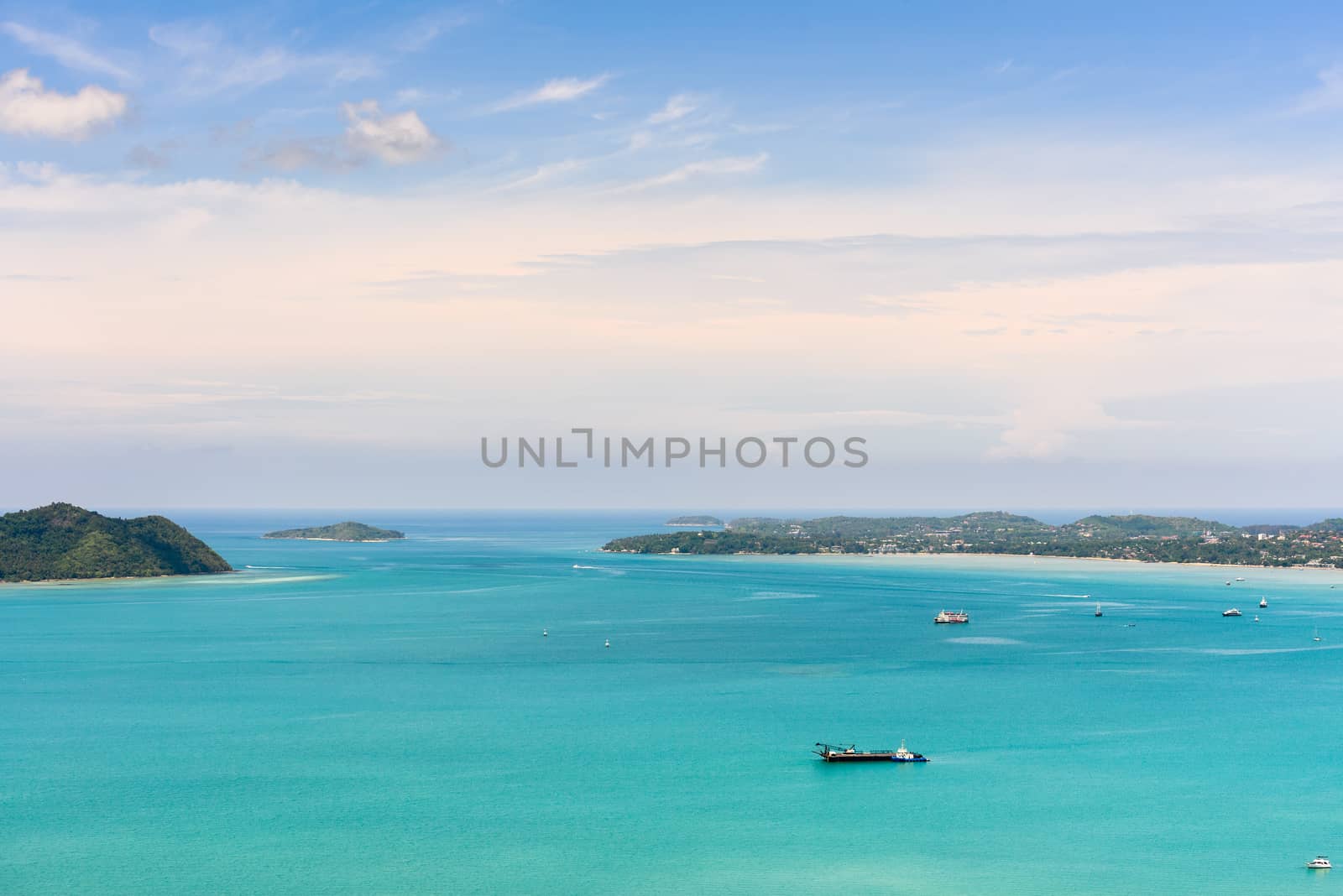 High angle view blue sky over the Andaman Sea and seaside tourist town from Khao-Khad mountain viewpoint famous attractions in Phuket island, Thailand