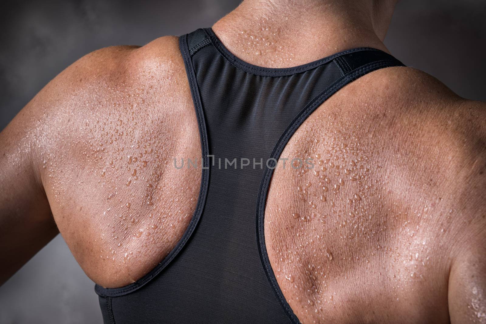 Picture of a trained back of a middle aged woman over 45 years