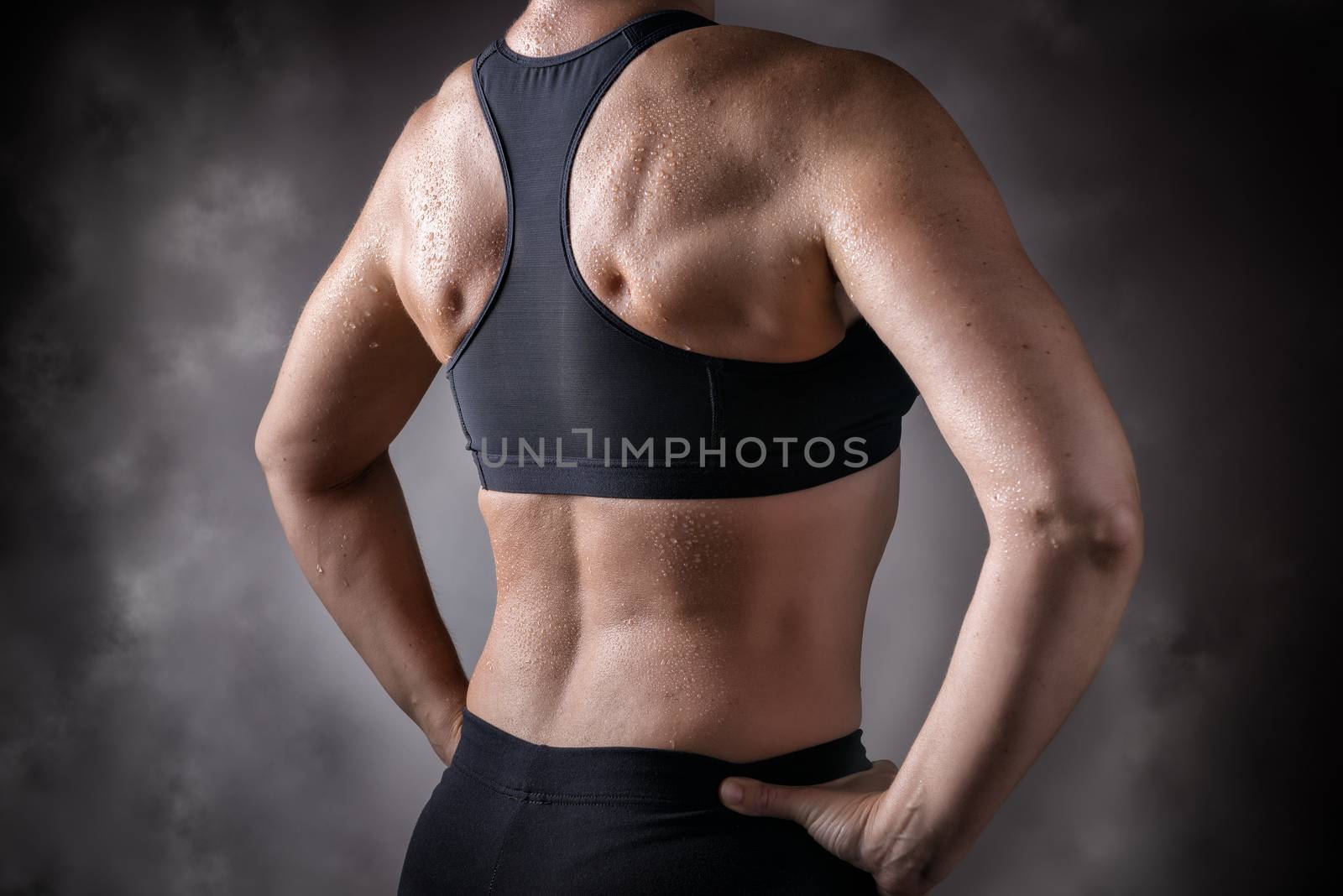 Picture of a trained back of a middle aged woman over 45 years