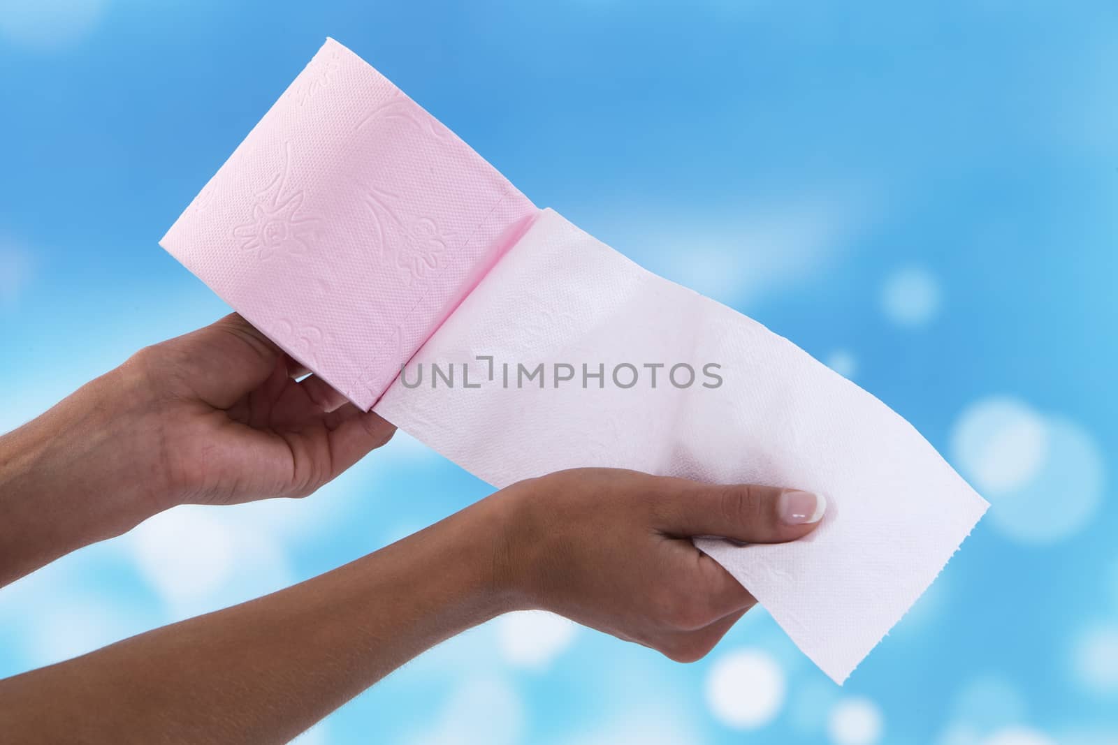 female hand Hand holding toilet paper` by JPC-PROD
