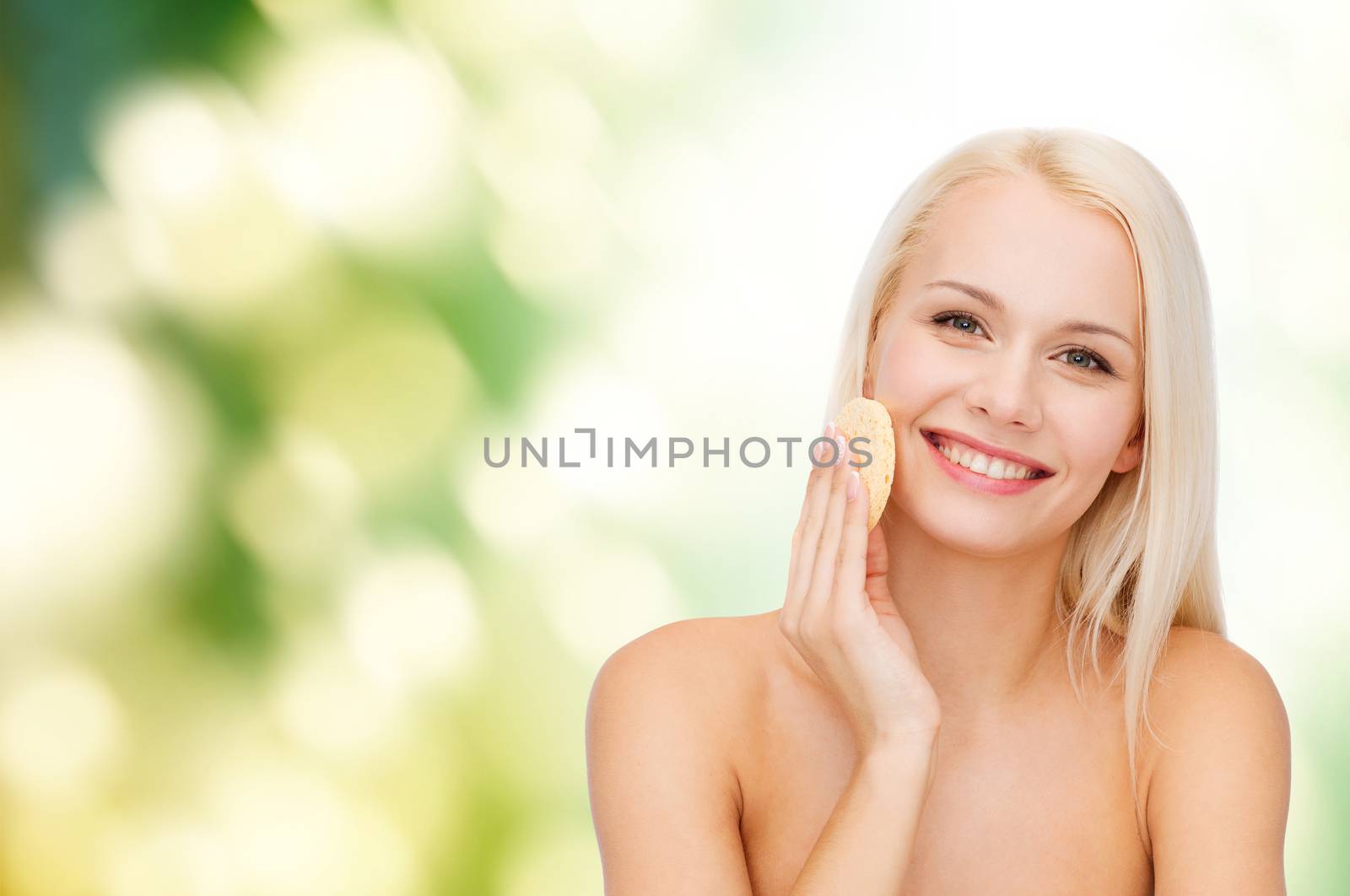 health, beauty and spa concept - beautiful woman with sponge