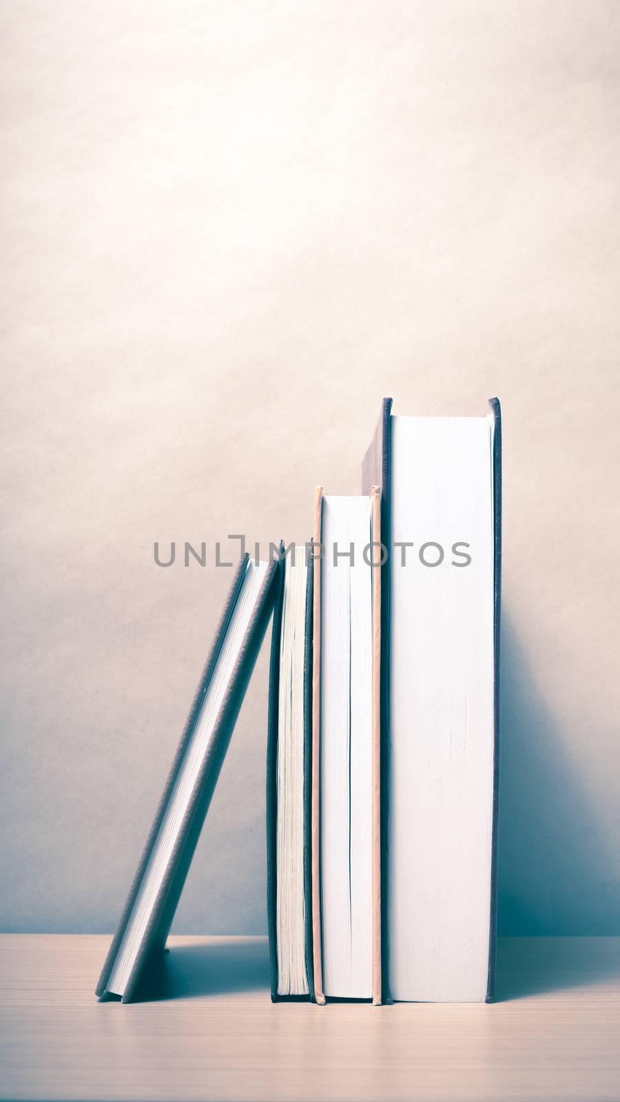 stand up of book on wood table background vintage style
