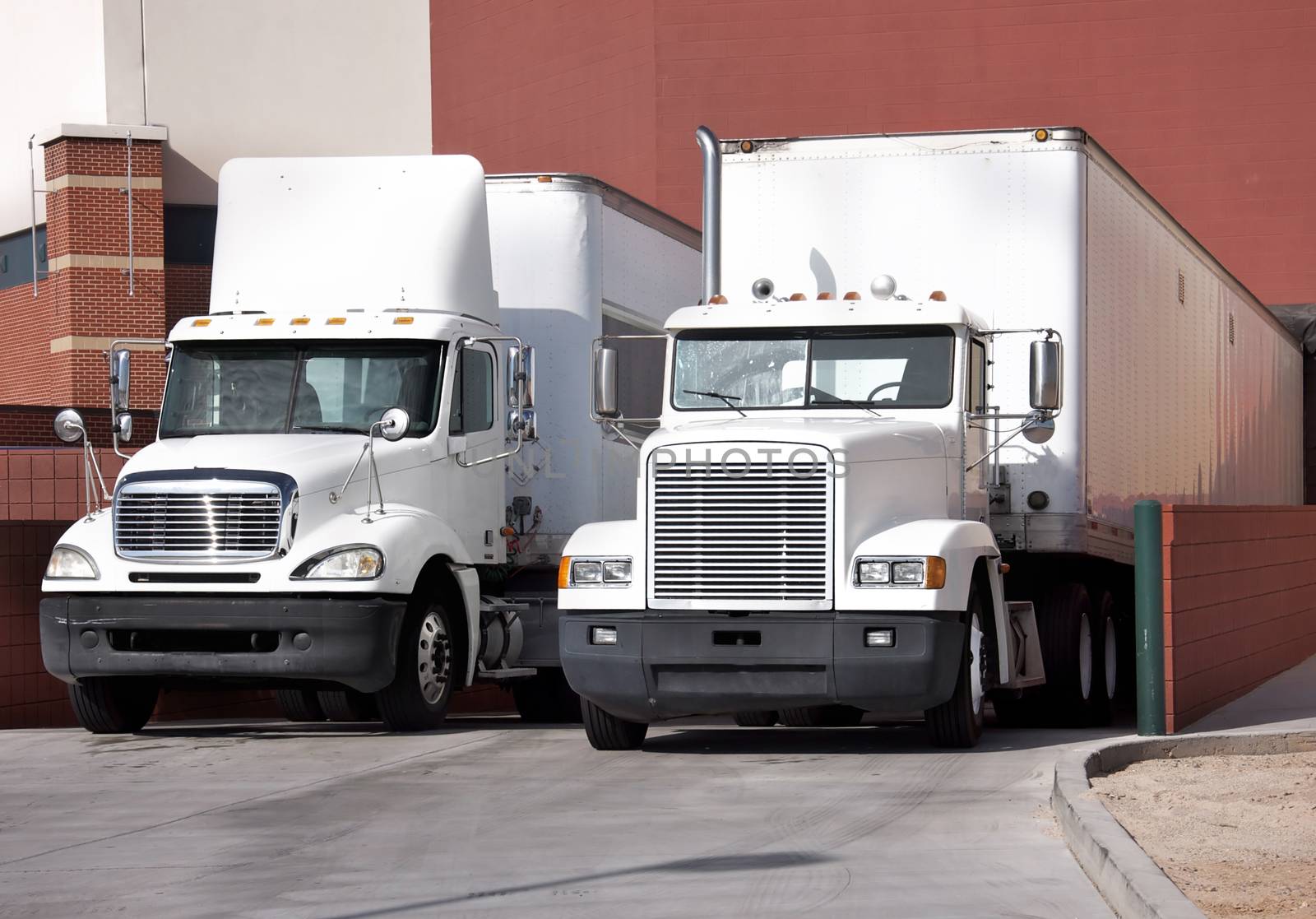 trucks at loading dock shipping industry by Paulmatthewphoto