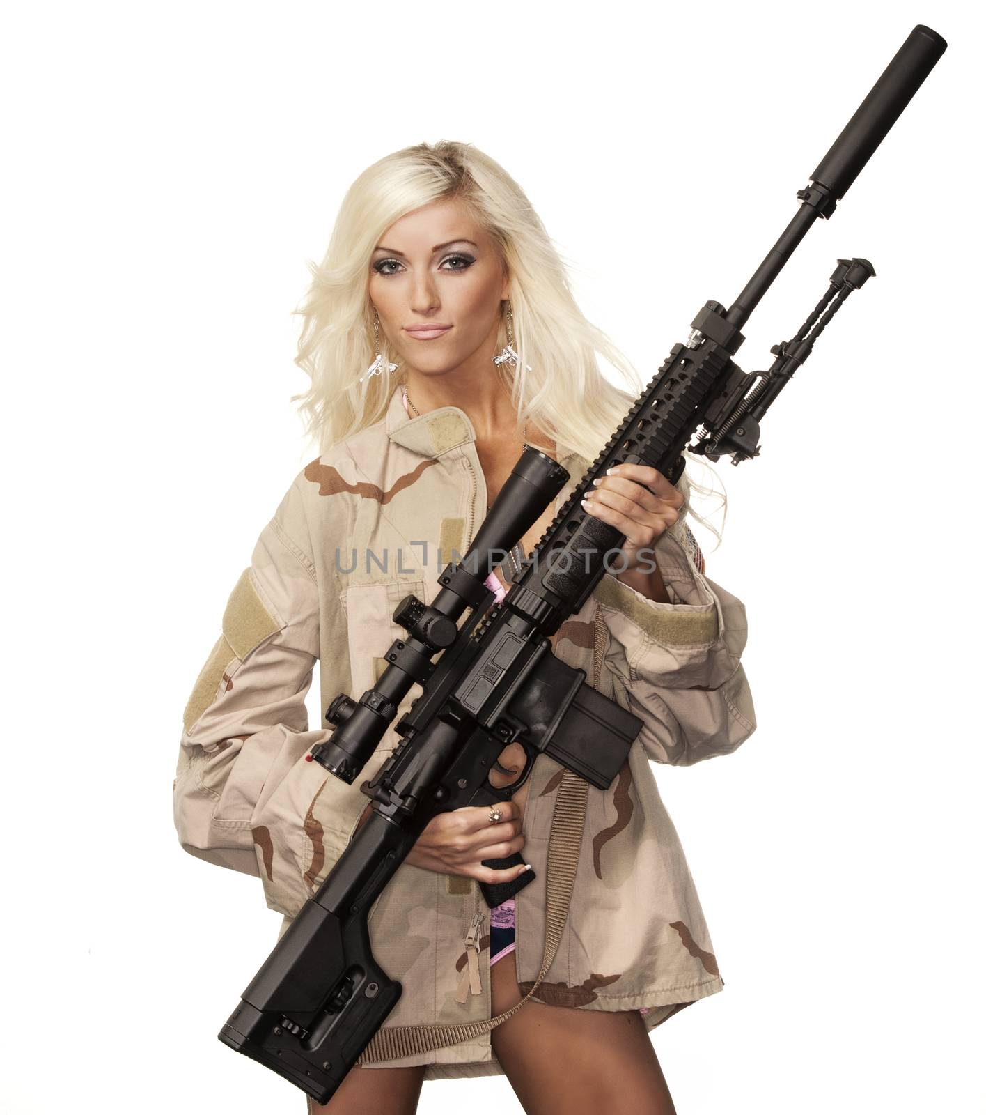 Beautiful sexy blond woman isolated holding army weapon