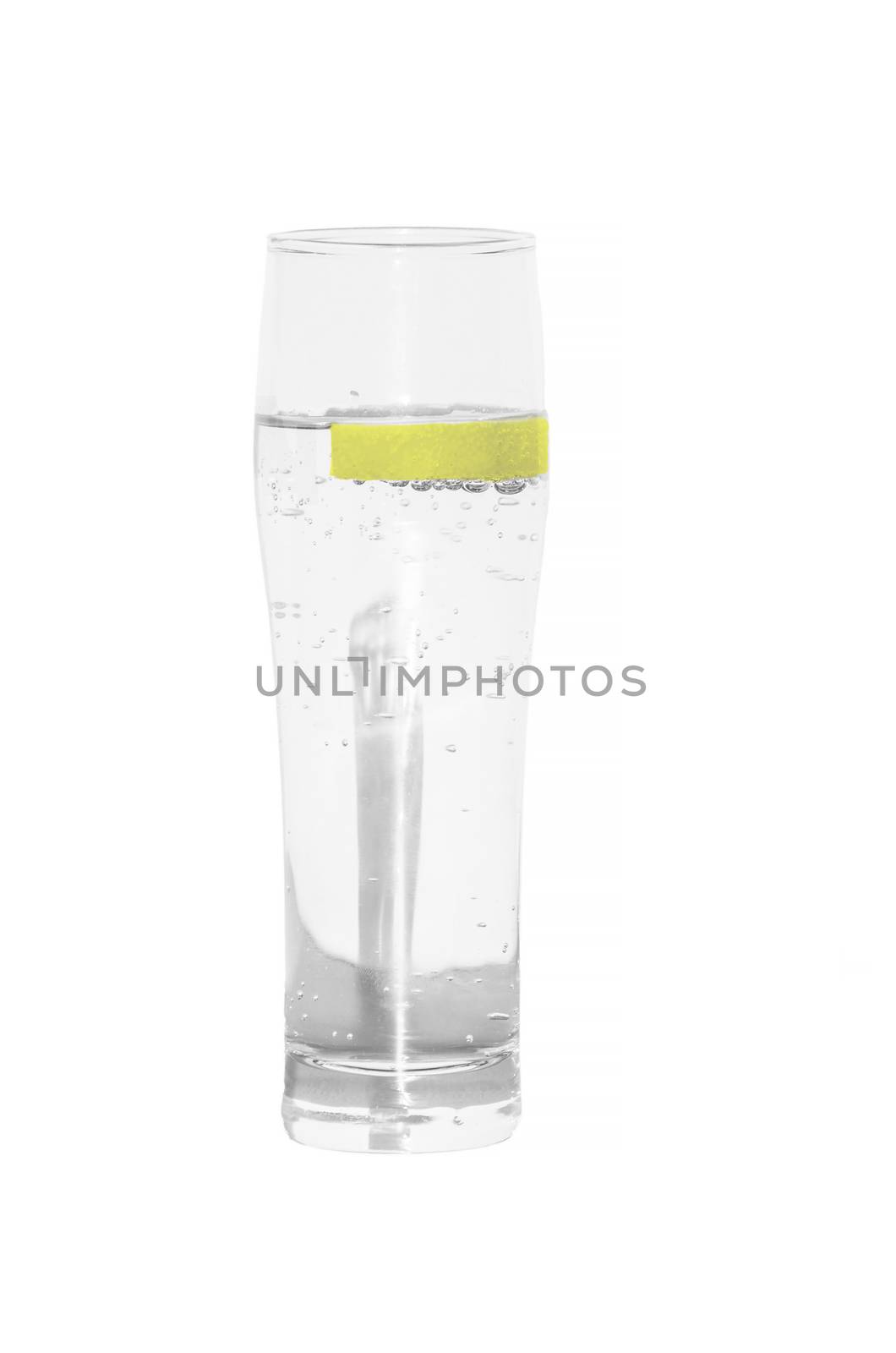 Mineral water glass isolated with lemon slice.