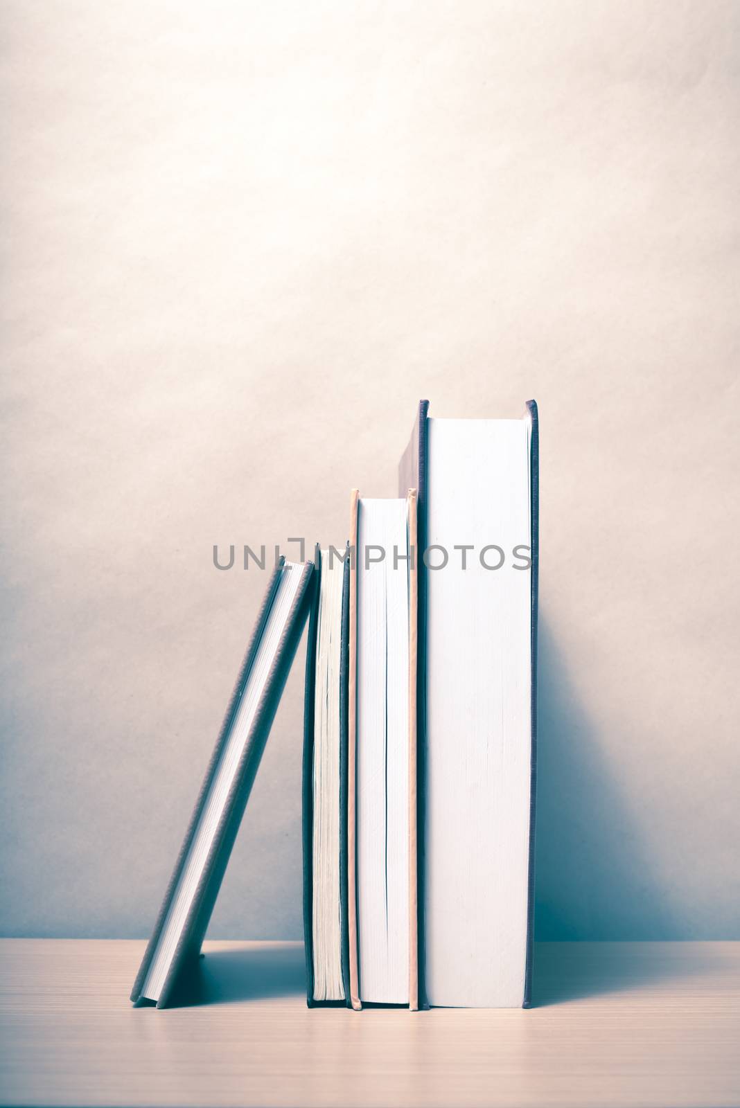 stand up of book on wood table background vintage style