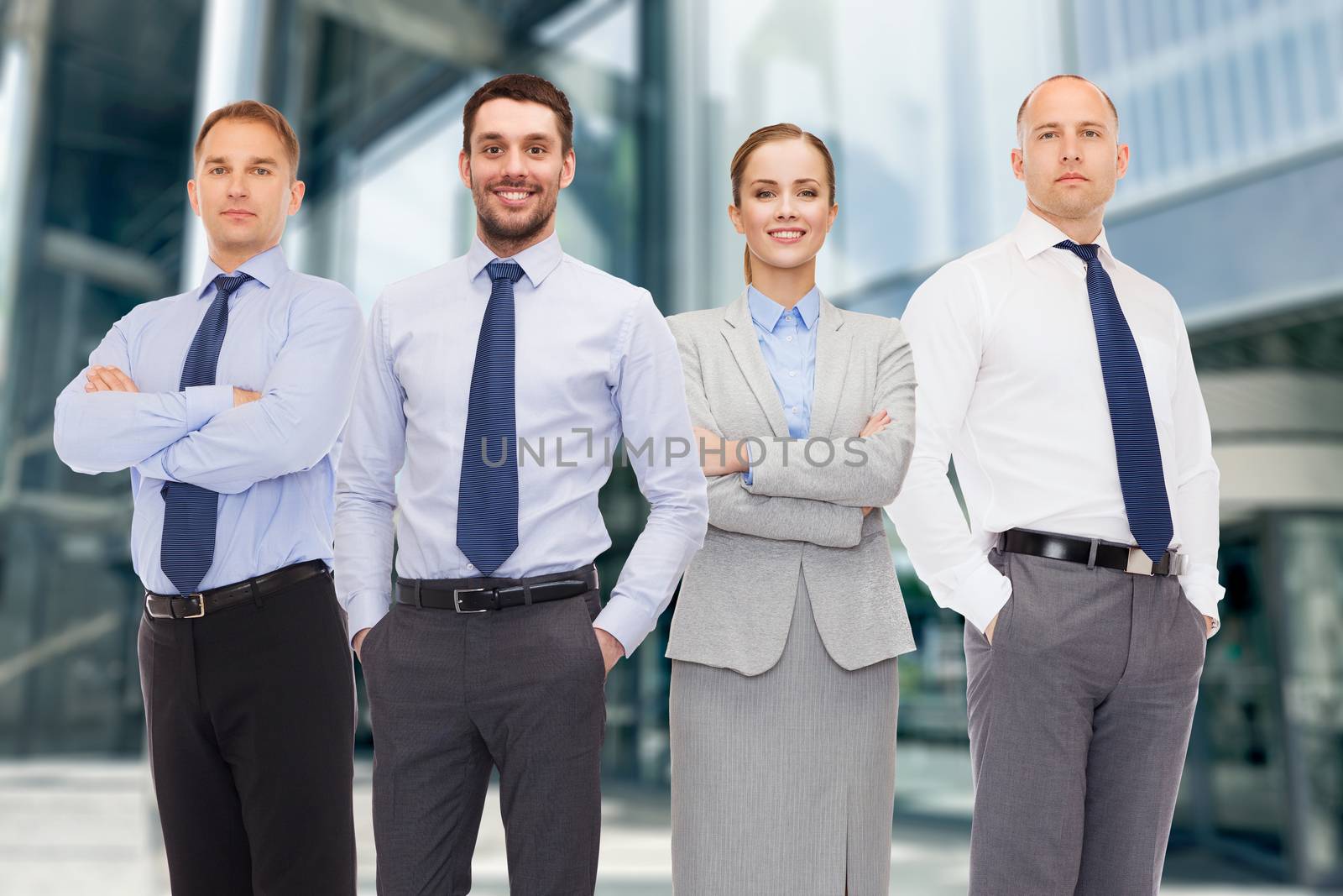 group of smiling businessmen outdoors by dolgachov