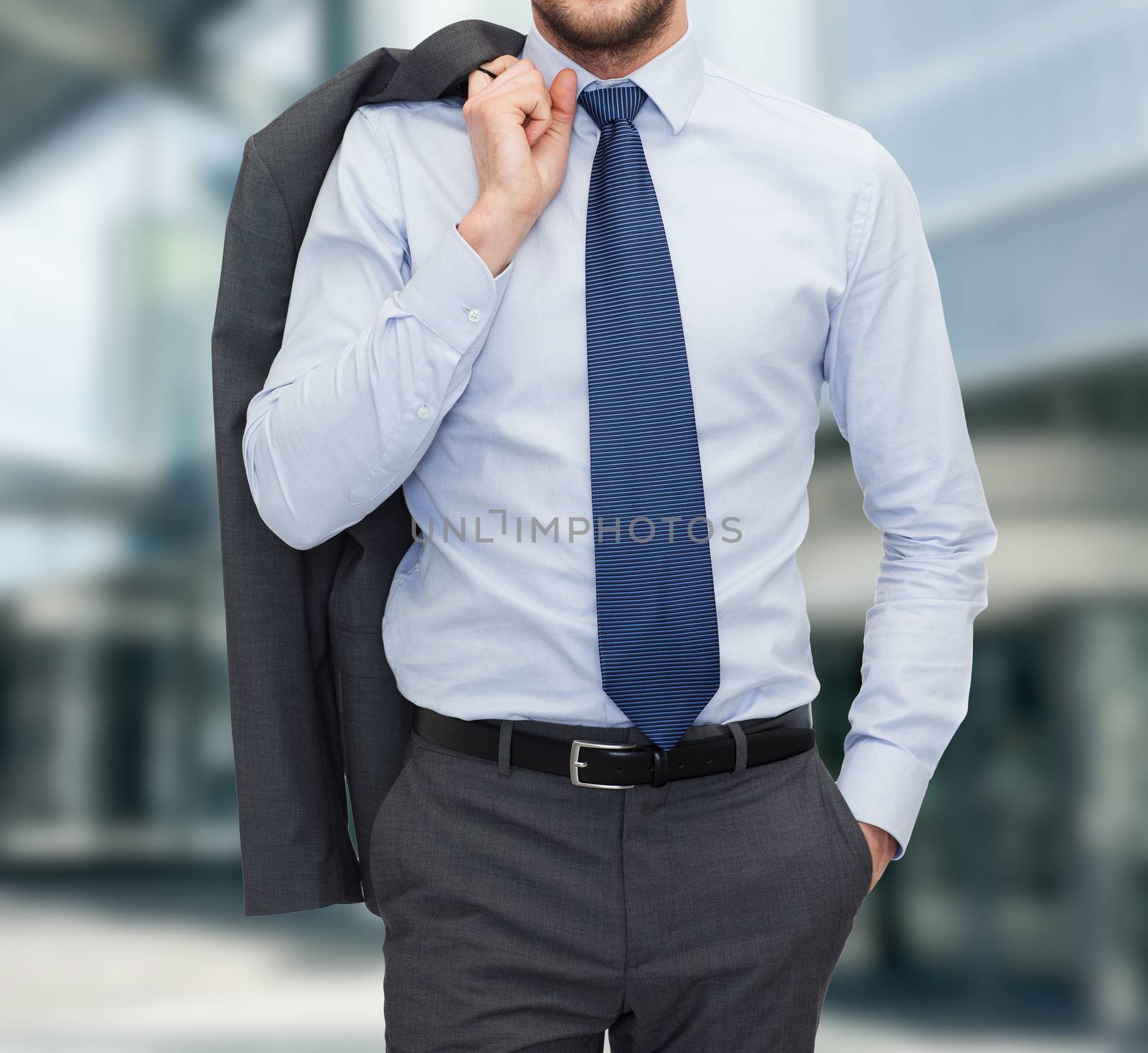 business and people concept - close up of businessman standing over business center background