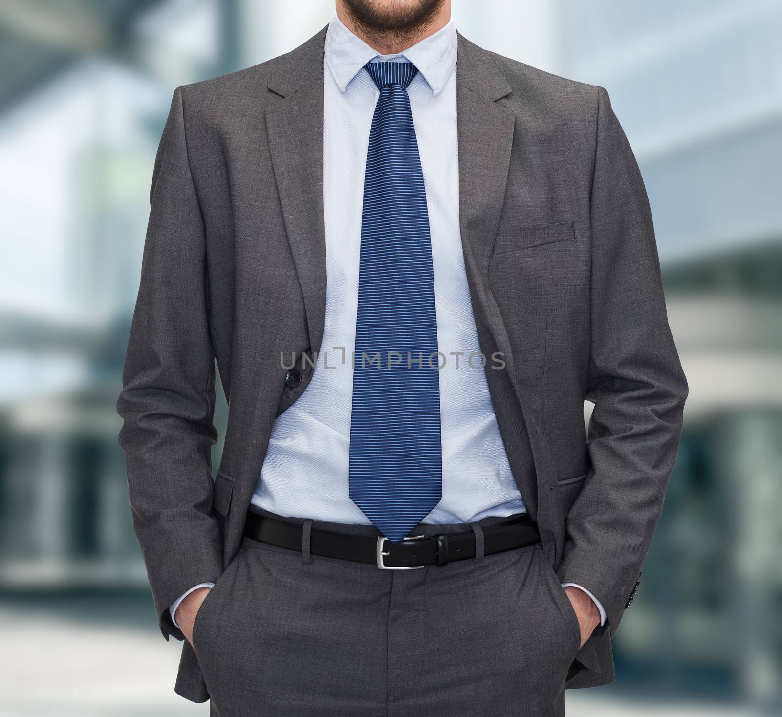 business and people concept - close up of businessman standing over business center background