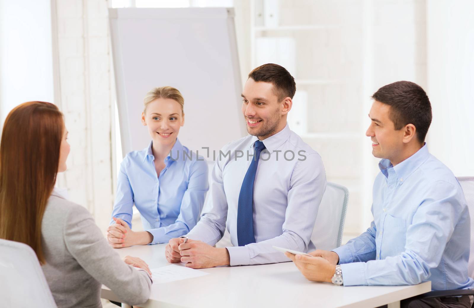 business team interviewing applicant in office by dolgachov