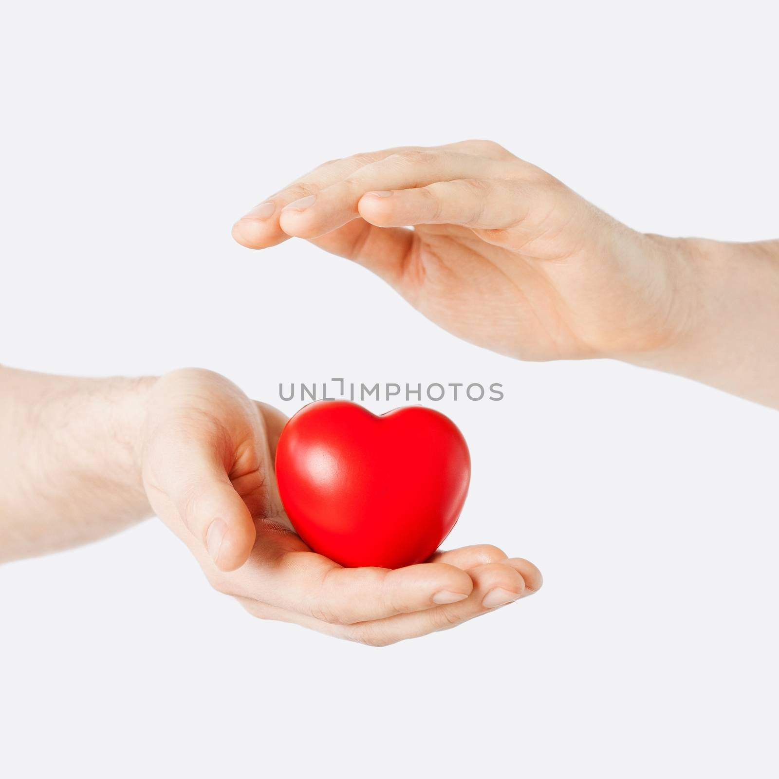male hands with small red heart by dolgachov