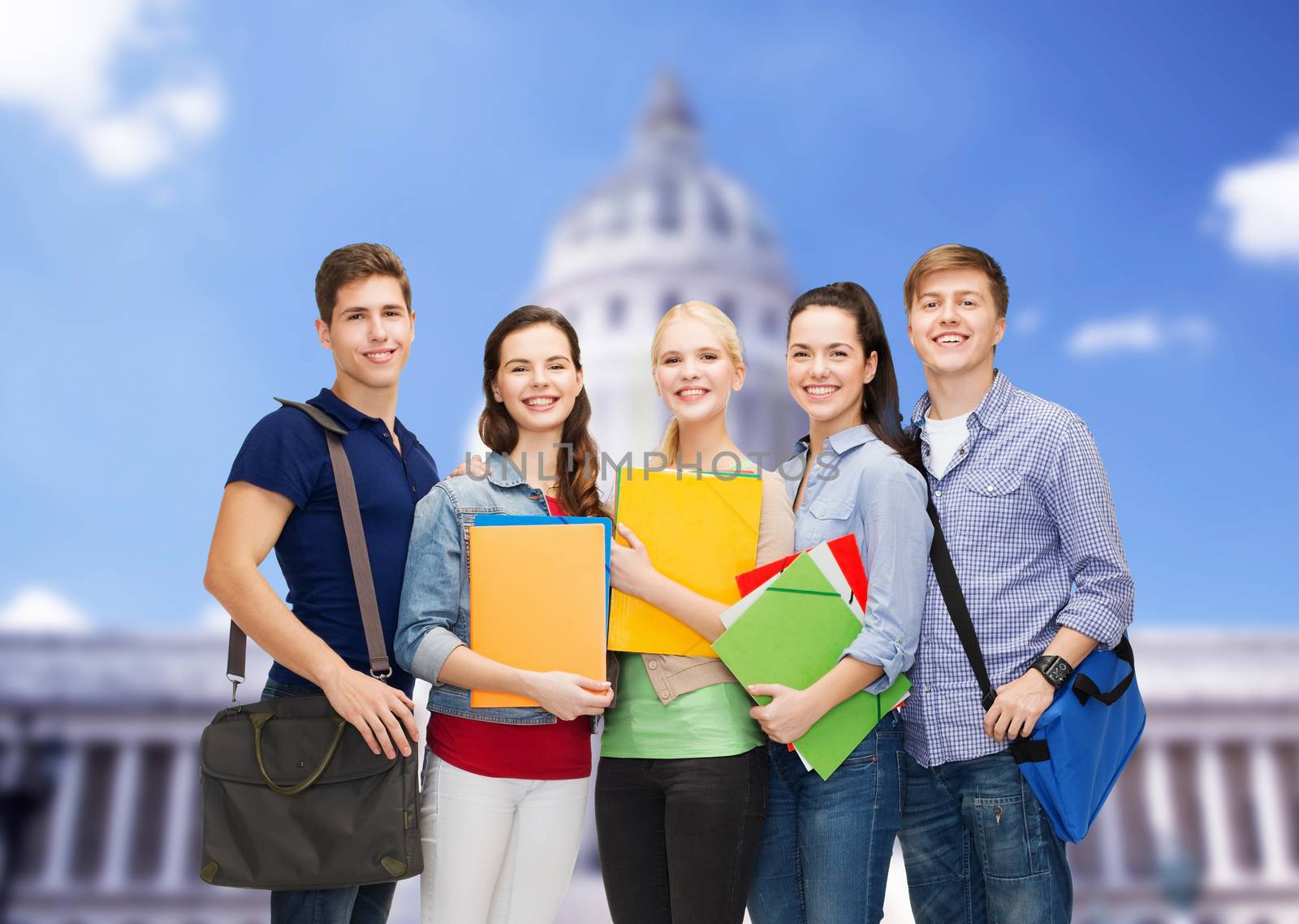 education and people concept - group of smiling students standing