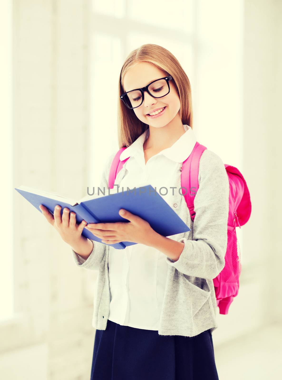 girl reading book at school by dolgachov