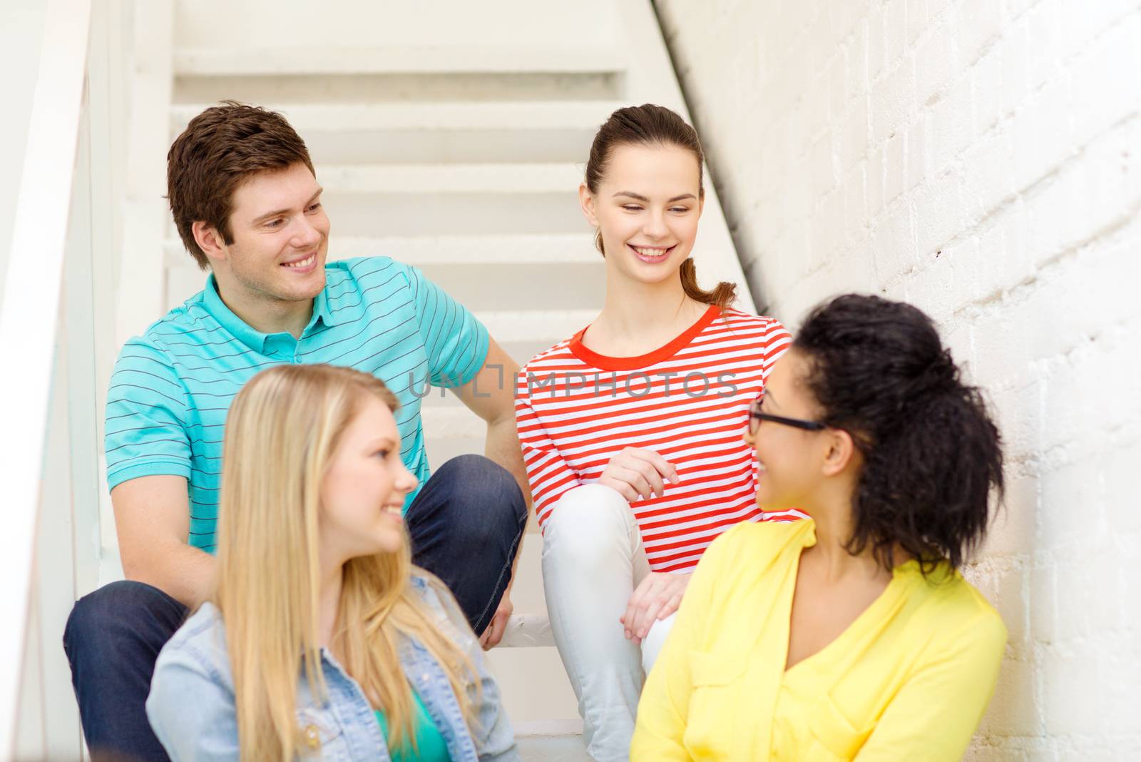 frienship and education concept - smiling teenagers hanging out