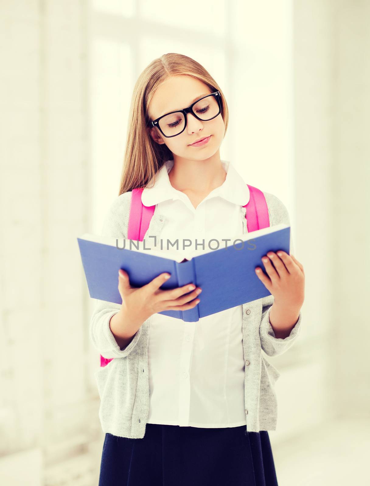 girl reading book at school by dolgachov