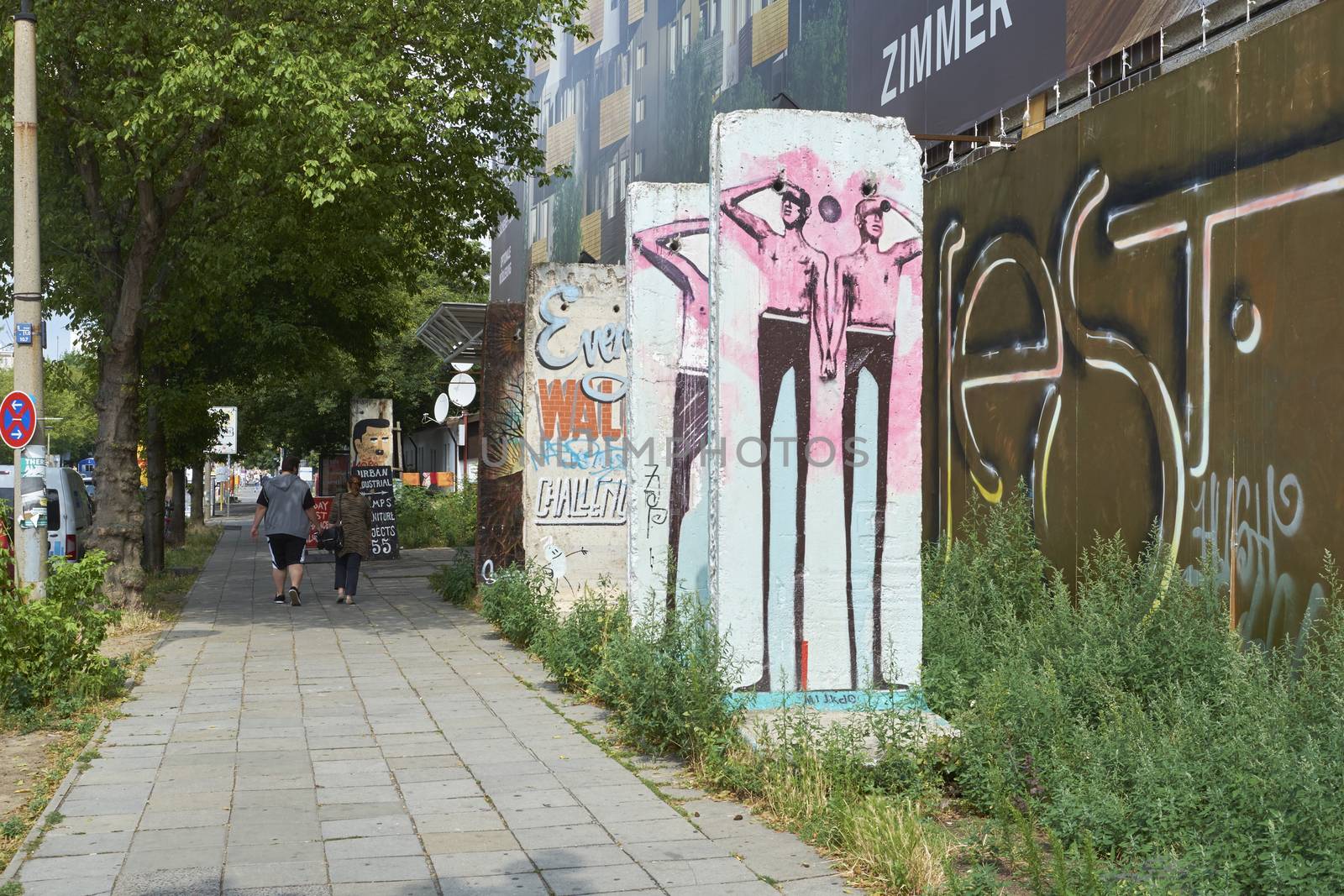 BERLIN, GERMANY - JULY 07: Segments of Berlin Wall in East Berlin filled with grafitti art. July 07, 2015 in Berlin.
