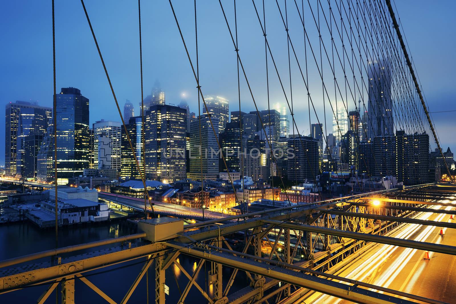 Brooklyn Bridge at night with car traffic