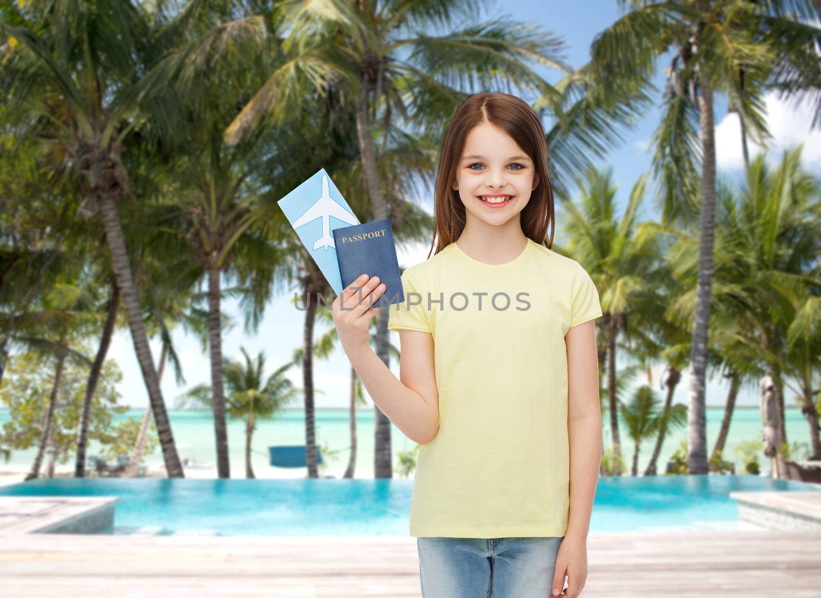 smiling little girl with ticket and passport by dolgachov