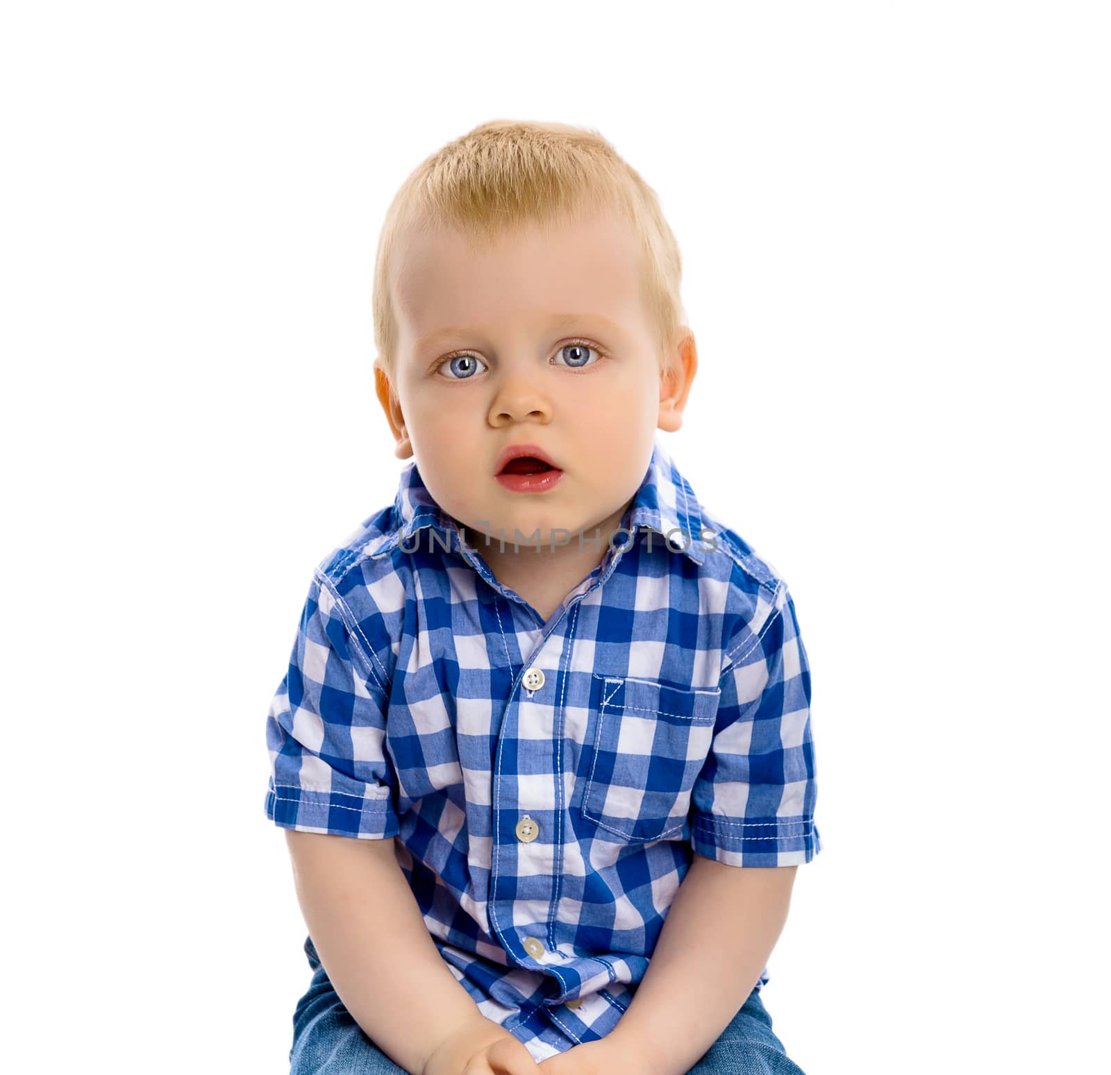 blue-eyed baby boy in a plaid shirt