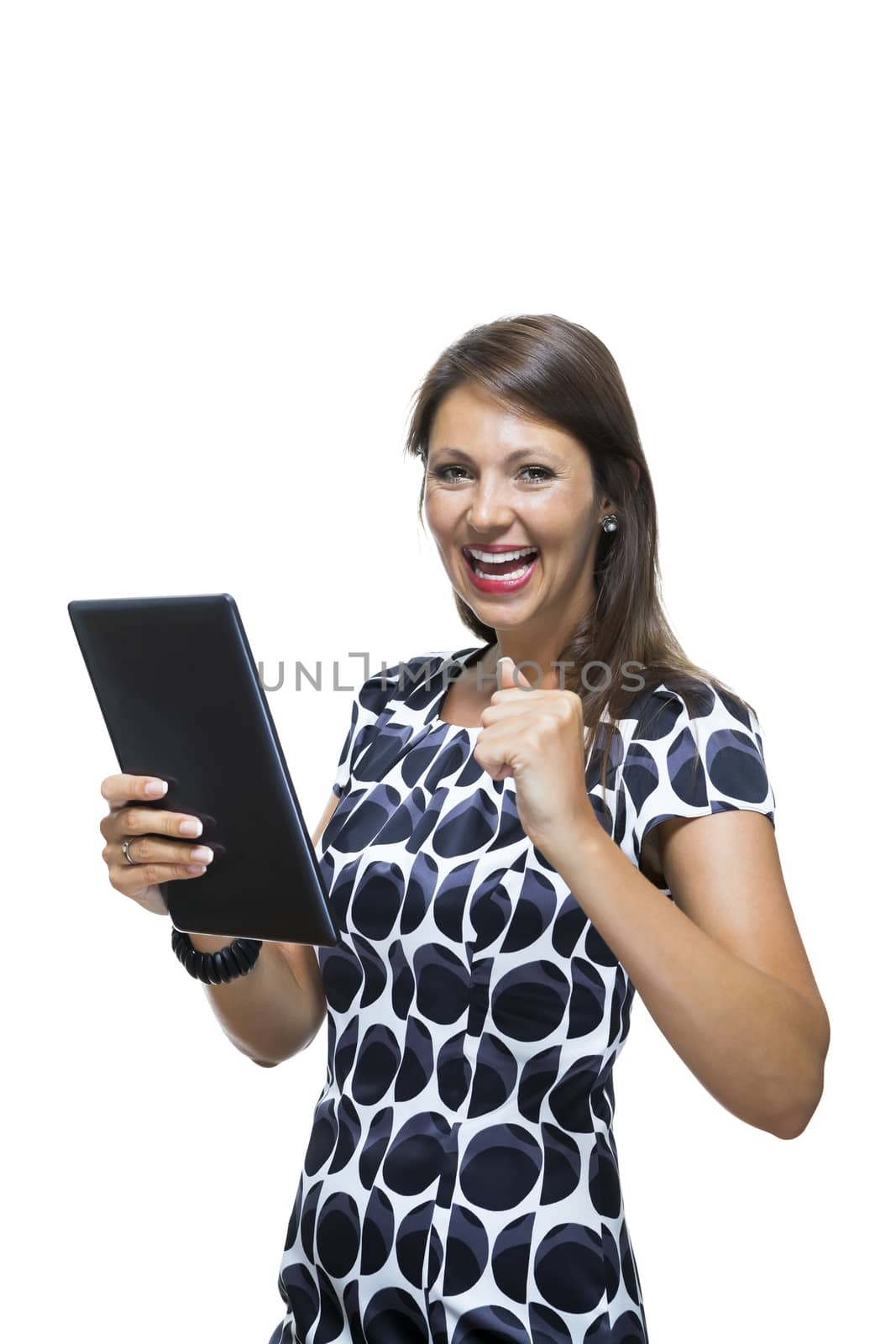 Portrait of a Smiling Lady in an Elegant Printed Dress Holding a Tablet Computer with Copy Space While Looking at the Camera. Isolated on White Background.