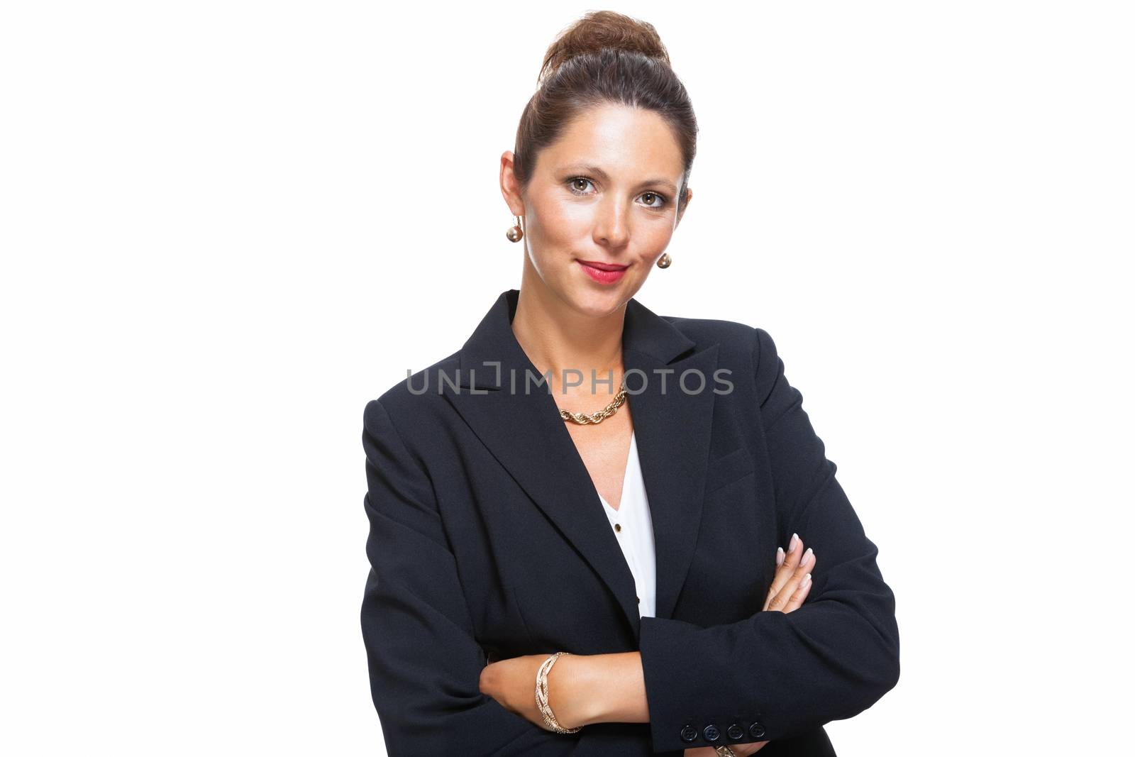 Portrait of a Confident Young Businesswoman in Black Suit, Smiling at the Camera with Arms Crossing Over her Stomach, Isolated on White Background