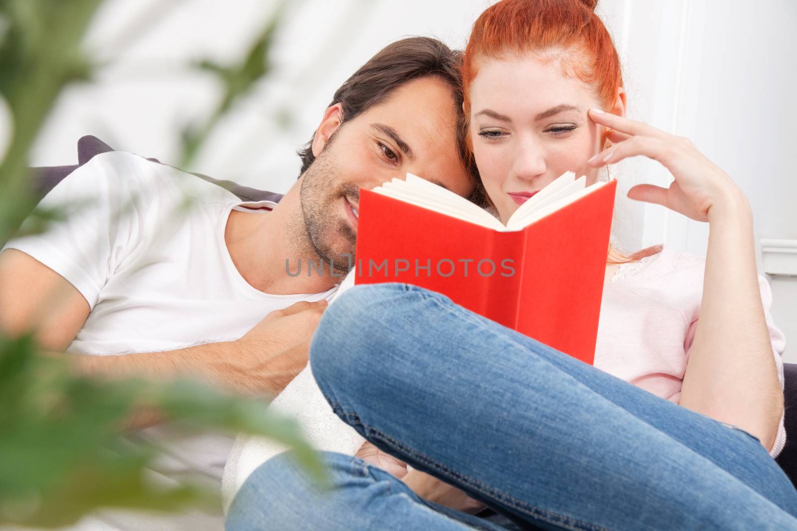 Sweet Young Couple Reading a Book Together by juniart