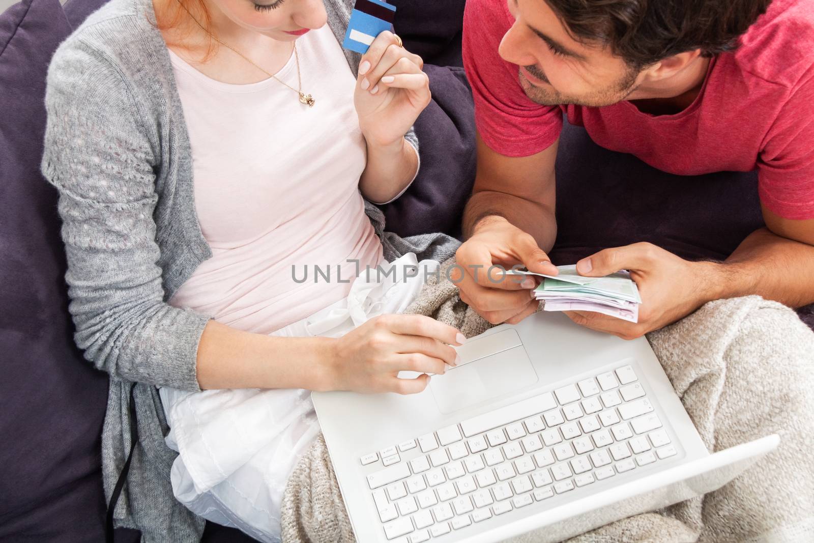 Young Couple Watching a Movie on Laptop Together by juniart