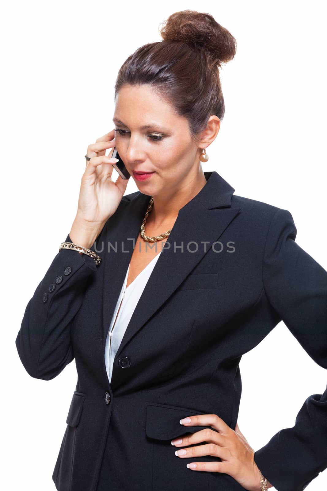 Portrait of a Happy Young Businesswoman Wearing Black Suit, Calling Someone on Mobile Phone. Isolated on White Background.