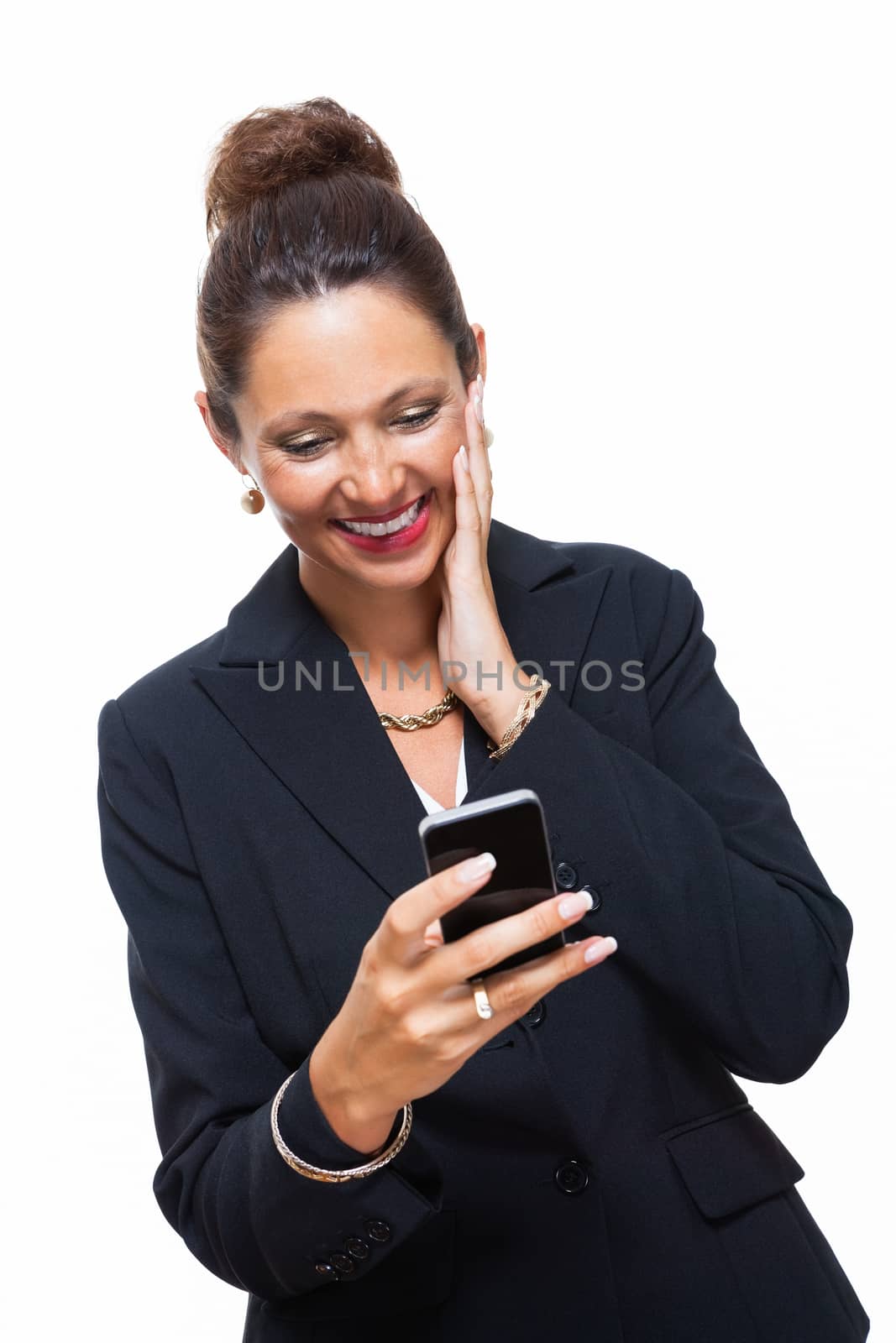 Portrait of a Happy Young Businesswoman Wearing Black Suit, Calling Someone on Mobile Phone. Isolated on White Background.