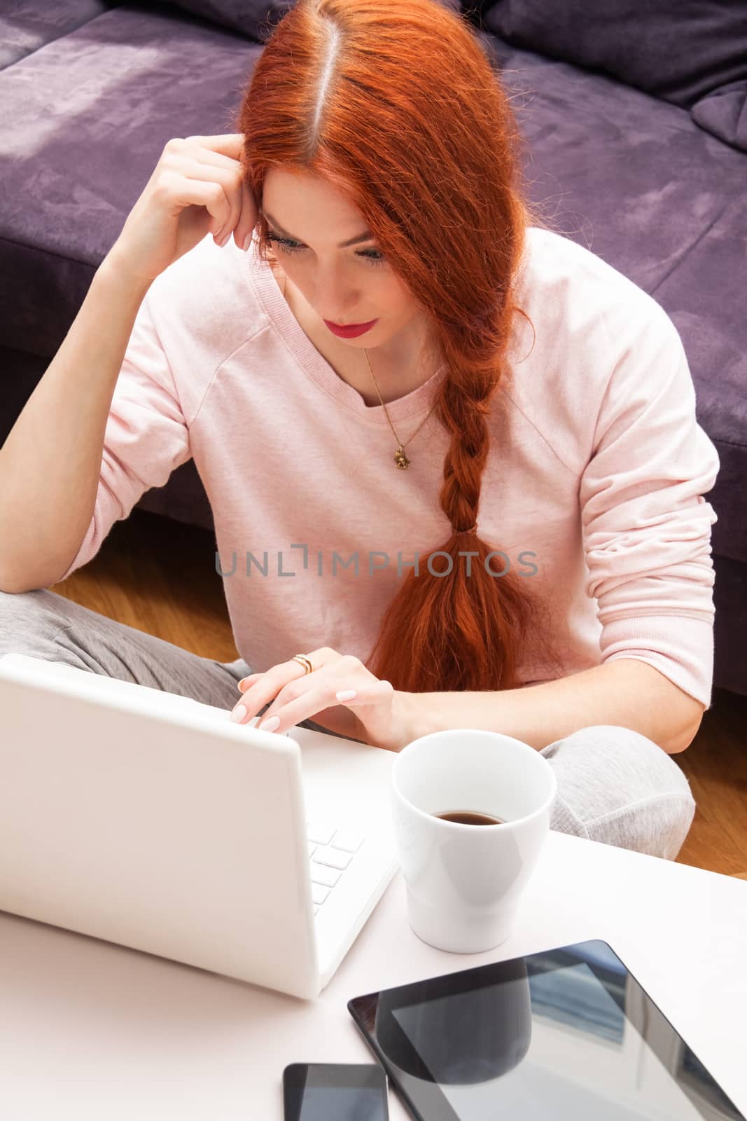 Young Woman Using Laptop In the Living Room by juniart