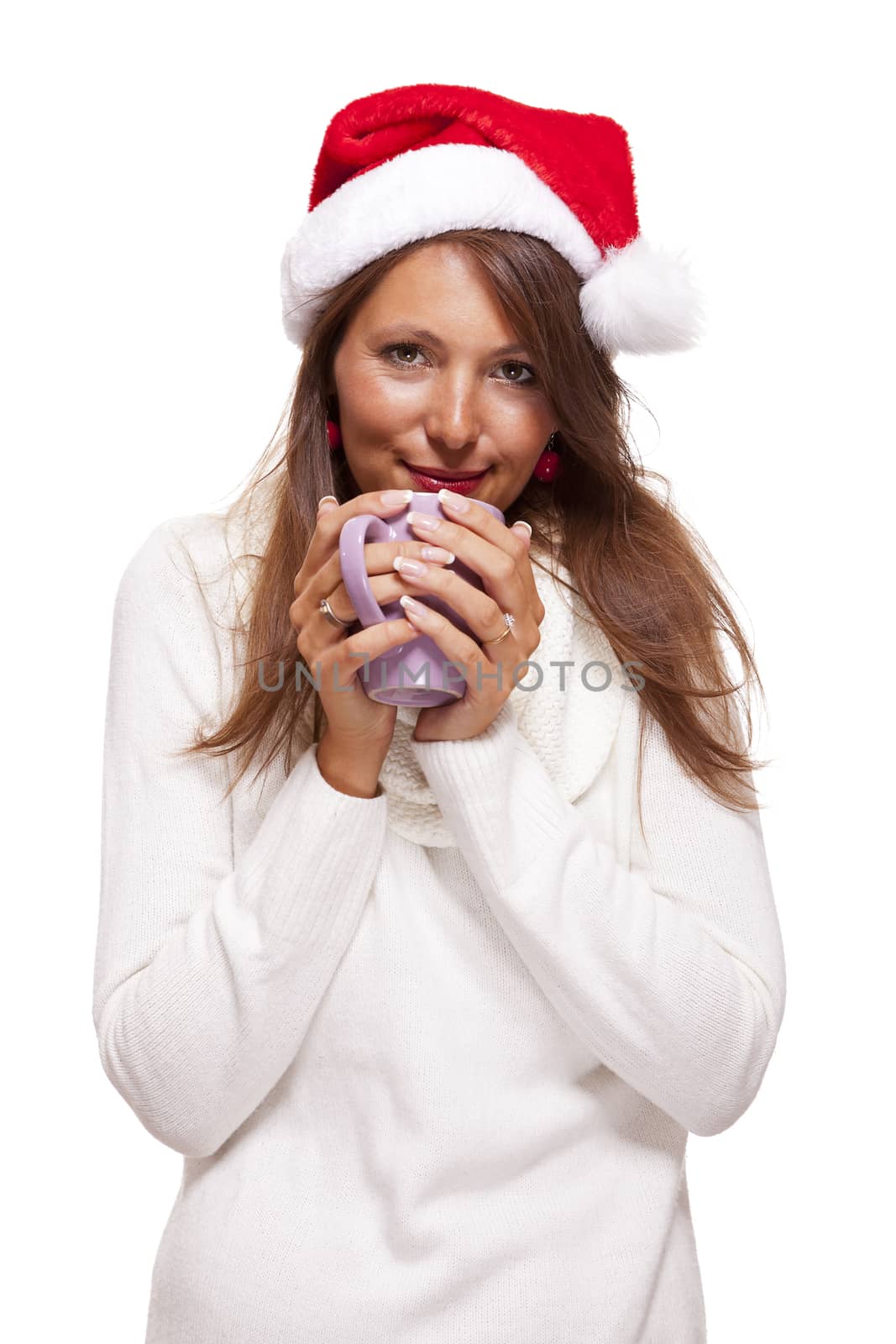 Cold young woman in a Santa hat sipping coffee tea by juniart