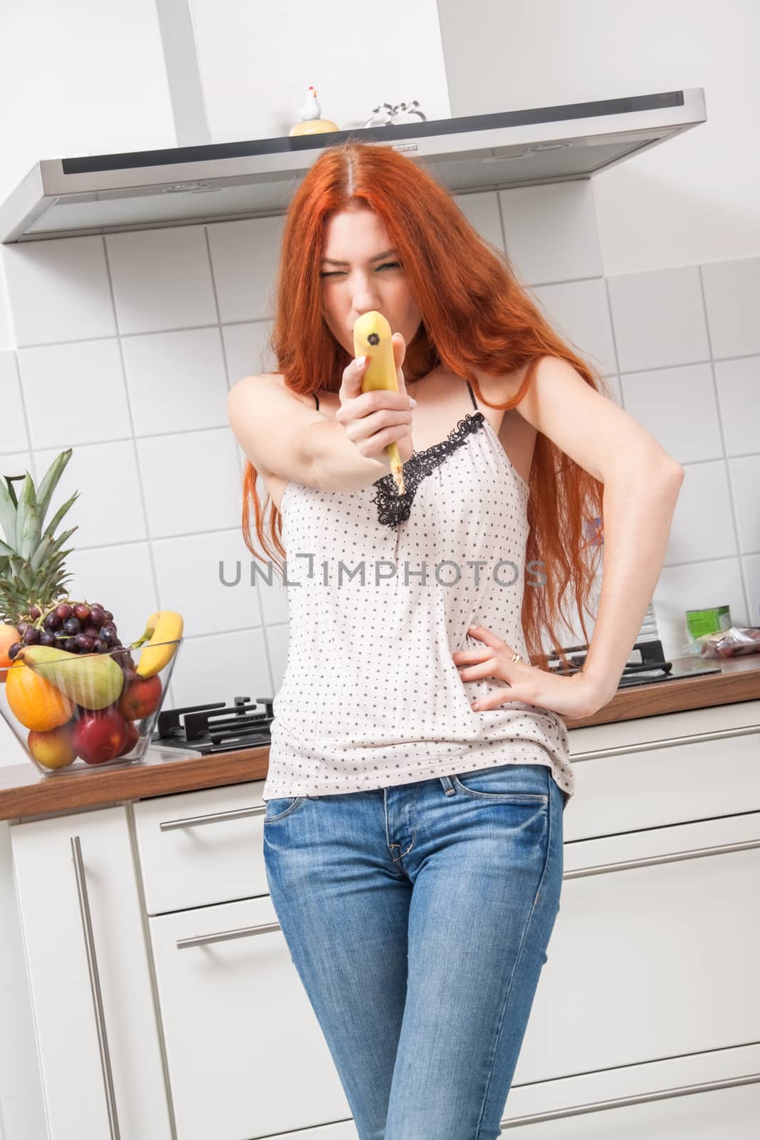Happy Woman Holding Banana Dancing in the Kitchen by juniart