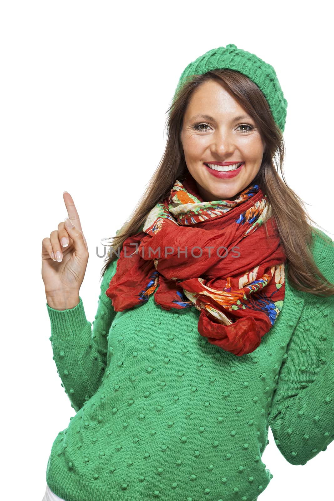 Excited exuberant pretty young woman cheering and smiling and raising her hands in the air with a joyful expression, isolated on white