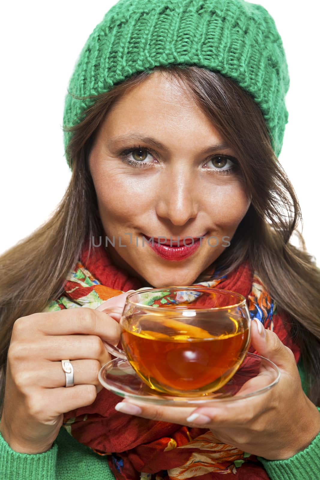 Attractive woman warming up with a cup of hot tea by juniart