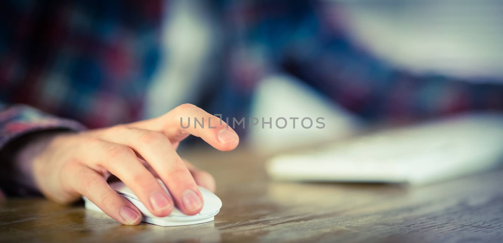 Hipster businessman working at his desk in his office